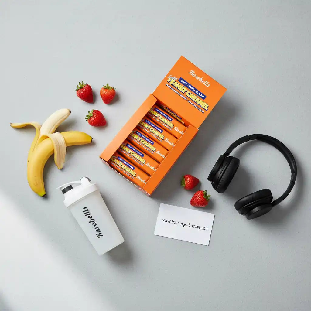Barebells Peanut Caramel Proteinriegel mit Banane, Erdbeeren, Shaker und Kopfhörern – ideal für Sport und Training